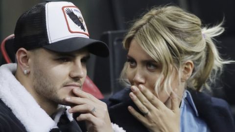 Inter Milan's Mauro Icardi is flanked by his wife Wanda Nara during the Europa League, round of 32, second leg soccer match between Inter Milan and SK Rapid Vienna, at the San Siro stadium in Milan, Italy, Thursday, Feb. 21, 2019. (AP Photo/Luca Bruno)