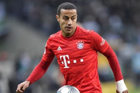 Bayern's Thiago plays during the German Bundesliga soccer match between Borussia Moenchengladbach and Bayern Munich at the Borussia Park in Moenchengladbach, Germany, Saturday, Dec. 7, 2019. (AP Photo/Martin Meissner)