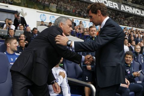 Tottenham Hotspur's manager Andre Villas-Boas, right, shakes-hand with Chelsea's manager Jose Mourinho before the start of their English Premier League soccer match at White Hart Lane, London, Saturday, Sept. 28, 2013. (AP Photo/Sang Tan)