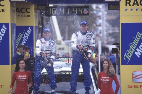 FIA World Rally Champs
Catalunya Rally, Spain. 30/3-2/4/2000
Colin McRae and co-driver Nicky Grist celebrate victory on the podium. Portrait.
photo: World © McKlein
tel: (+44) 0208 251 3000
e-mail: digital@latphoto.co.uk
35mm Original Image.