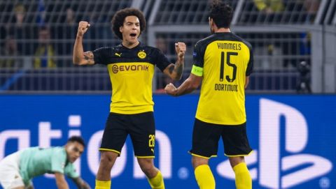 Dortmund's Axel Witsel, left, and Mats Hummels celebrate their team's 3-2 victory over Inter Milan in a Champions League soccer match, Tuesday, Nov. 5, 2019, in Dortmund, Germany. (David Inderlied/dpa via AP)