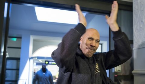 American basketball players LiAngelo and LaMelo's father LaVar Ball greets fans and journalists upon their arrival at the international airport in Vilnius, Lithuania, Wednesday, Jan. 3, 2018. LiAngelo and LaMelo Ball in December signed one-year contracts to play for Lithuanian professional basketball club Prienai - Birstonas Vytautas from a small of roughly 9000 people in southern Lithuania town Prienai, some 110 km (68 miles) of the Lithuanian capital Vilnius.(AP Photo/Mindaugas Kulbis)