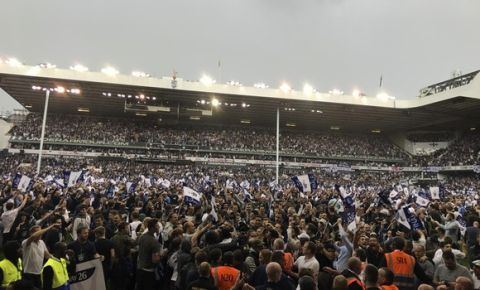 Fans invade the pitch after the English Premier League soccer match between Tottenham Hotspur and Manchester United at White Hart Lane stadium in London, Sunday, May 14, 2017. It was the last Spurs match at the old stadium, a new stadium is being built on the site. (AP Photo/Frank Augstein)