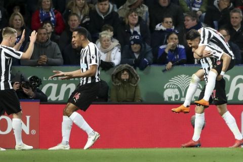 Newcastle United's Ayoze Perez bottom right celebrates scoring his side's first goal of the game, during the English Premier League soccer match between Leicester City and Newcastle United, at The King Power Stadium, in  Leicester England, Friday April 12, 2019. (Nick Potts/PA via AP)