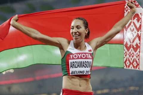 Belarus' Marina Arzamasova celebrates after winning the womens 800m final at the World Athletics Championships at the Bird's Nest stadium in Beijing, Saturday, Aug. 29, 2015. (AP Photo/David J. Phillip) 