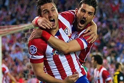 MADRID, SPAIN - APRIL 09:  Koke of Club Atletico de Madrid celebrates scoring the opening goal with David Villa of Club Atletico de Madrid  during the UEFA Champions League Quarter Final second leg match between Club Atletico de Madrid and FC Barcelona at Vicente Calderon Stadium on April 9, 2014 in Madrid, Spain.  (Photo by Gonzalo Arroyo Moreno/Getty Images)