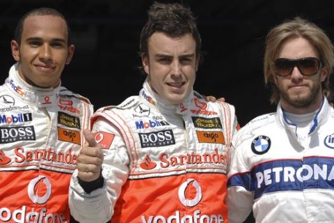 Spanish McLaren Mercedes Formula One driver Fernando Alonso, center, gives a thumbs up after setting the fastest time in the Qualifying session at the Hungaroring racetrack near Budapest, Hungary, Saturday, Aug. 4, 2007, as teammate British McLaren Mercedes Formula One driver Lewis Hamilton, left, reacts. Alonso spoiled Hamltons last lap. Right is third placed German Sauber BMW Formula One driver Nick Heidfeld. The Hungarian Grand Prix starts on Sunday, Aug. 5, 2007. (AP Photo/Bela Szandelszky)