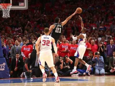 LOS ANGELES, CA - MAY 02:  Chris Paul #3 of the Los Angeles Clippers puts up the game winning shot over Tim Duncan #21 of the San Antonio Spurs with one second remaining in Game Seven of the Western Conference quarterfinals the 2015 NBA Playoffs as Clipper Blake Griffin stands by at Staples Center on May 2, 2015 in Los Angeles, California.  The Clippers won 111-109 to win the series four games to three.  NOTE TO USER: User expressly acknowledges and agrees that, by downloading and or using this photograph, User is consenting to the terms and conditions of the Getty Images License Agreement.  (Photo by Stephen Dunn/Getty Images)