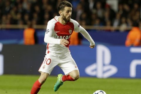 Monaco's Bernardo Silva goes for the ball during the Champions League semifinal first leg soccer match between Monaco and Juventus at the Louis II stadium in Monaco, Wednesday, May 3, 2017. (AP Photo/Claude Paris)