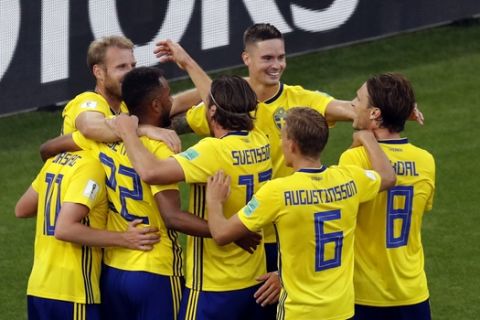 Sweden players celebrate after Mexico's Edson Alvarez scores an own goal during the group F match between Mexico and Sweden, at the 2018 soccer World Cup in the Yekaterinburg Arena in Yekaterinburg , Russia, Wednesday, June 27, 2018. (AP Photo/Efrem Lukatsky)