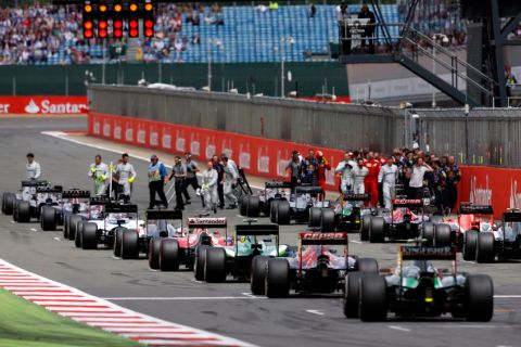 NORTHAMPTON, ENGLAND - JULY 06:  Drivers return to the grid for a restart after the race was red-flagged following a collision during the British Formula One Grand Prix at Silverstone Circuit on July 6, 2014 in Northampton, United Kingdom.  (Photo by Drew Gibson/Getty Images)