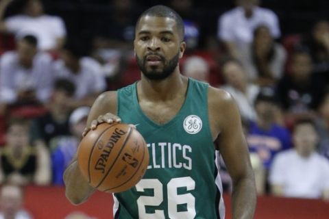 Boston Celtics' Aaron Harrison plays against the Memphis Grizzlies in an NBA summer league basketball game Thursday, July 11, 2019, in Las Vegas. (AP Photo/John Locher)