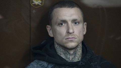 Krasnodar's midfielder Pavel Mamayev attends hearings in a court in Moscow, Russia, Thursday, Oct. 11, 2018. Krasnodar midfielder Pavel Mamaev and Zenit Saint Petersburg forward Alexander Kokorin will remain behind bars until Dec. 8 pending their trial for "hooliganism", a crime for which they face up to five years in prison, Russian agencies reported.  (AP Photo/Pavel Golovkin)