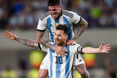 Argentina's Lionel Messi celebrates with teammate Rodrigo De Paul scoring his side's second goal against Panama during an international friendly soccer match in Buenos Aires, Argentina, Thursday, March 23, 2023. (AP Photo/Gustavo Garello)