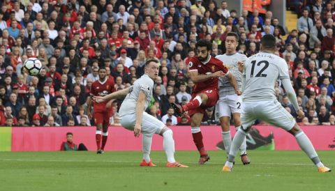 Liverpool's Mohamed Salah takes a shot at goal, unsuccessfull, against Manchester United, during their English Premier League soccer match at Anfield in Liverpool, England, Saturday Oct. 14, 2017. (Peter Byrne/PA via AP)