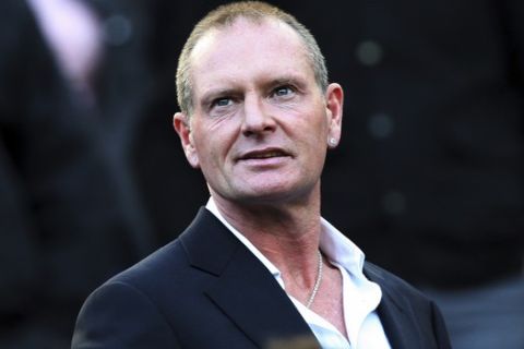 FILE - In this Oct. 16, 2011 file photo, Paul Gascoigne attends the English Premier League soccer match between Newcastle United and Tottenham Hotspur at St James' Park, Newcastle, England. Former England midfielder Paul Gascoigne has been charged with sexually assaulting a woman on board a train. Gascoigne is to appear at a nearby court on Dec. 11, 2018. (AP Photo/Scott Heppell, File)