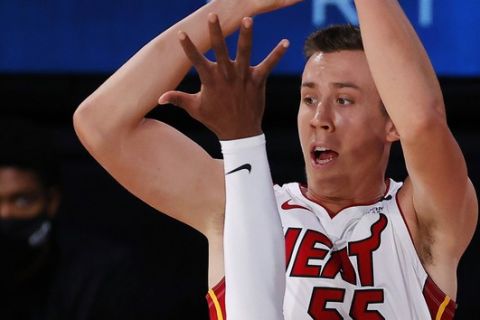 Miami Heat's Duncan Robinson shoots over Oklahoma City Thunder's Luguentz Dort during the first quarter of an NBA basketball game Wednesday, Aug. 12, 2020, in Lake Buena Vista, Fla. (Kevin C. Cox/Pool Photo via AP)