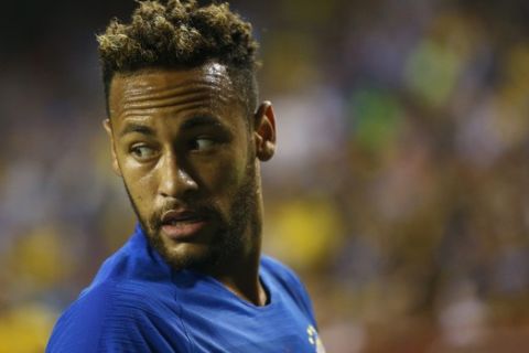 Brazil forward Neymar speaks with a teammate in the first half of a soccer match against El Salvador, Tuesday, Sept. 11, 2018, in Landover, Md. (AP Photo/Patrick Semansky)