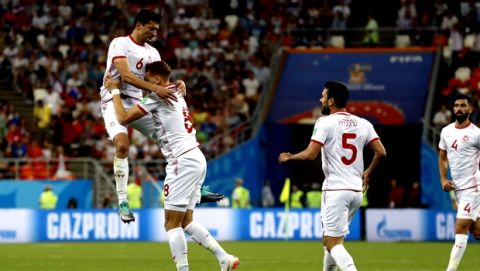 Tunisia's Fakhreddine Ben Youssef (8) celebrates with his teammates after scoring his side's first goal during the group G match between Panama and Tunisia at the 2018 soccer World Cup at the Mordovia Arena in Saransk, Russia, Thursday, June 28, 2018. (AP Photo/Darko Bandic)