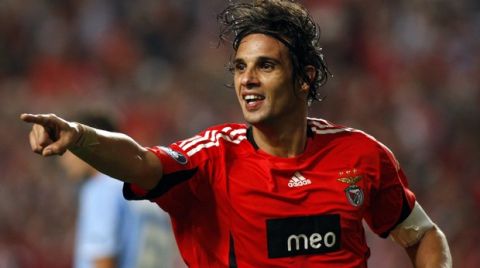Benfica's Nuno Gomes celebrates after scoring his team's second goal against Napoli during their UEFA Cup first round, second leg, soccer match Thursday, Oct. 2 2008, at the Luz stadium in Lisbon. Benfica defeated Napoli 2-0 to advance in the tournament. (AP Photo/Joao Henriques)