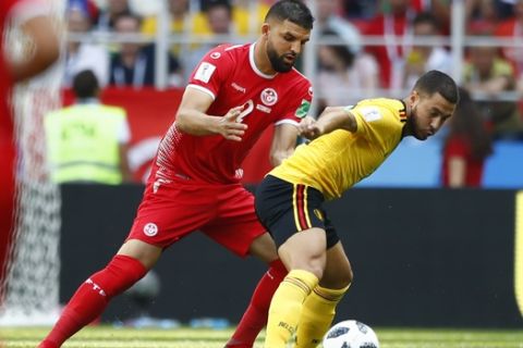 Tunisia's Syam Ben Youssef, left, and Belgium's Eden Hazard challenge for the ball during the group G match between Belgium and Tunisia at the 2018 soccer World Cup in the Spartak Stadium in Moscow, Russia, Saturday, June 23, 2018. (AP Photo/Matthias Schrader)