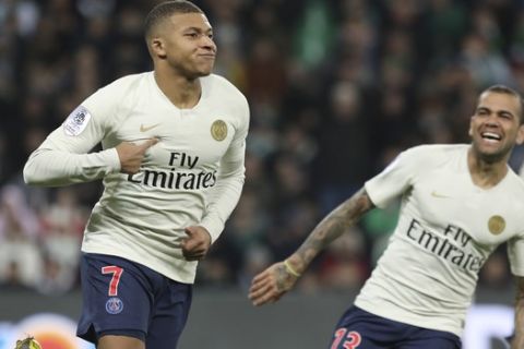PSG forward Kylian Mbappe, left, celebrates after scoring the opening goal during the French League One soccer match between Saint-Etienne and Paris Saint-Germain, at the Geoffroy Guichard stadium, in Saint-Etienne, central France, Sunday, Feb. 17, 2019. (AP Photo/Laurent Cipriani)