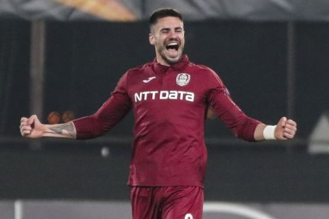 CFR's Andrei Burca celebrates at the end of the Europa League group E soccer match between CFR Cluj and Celtic, at the Constantin Radulescu stadium, in Cluj, Romania, Thursday, Dec. 12, 2019. (AP Photo/Cristian Cosma)