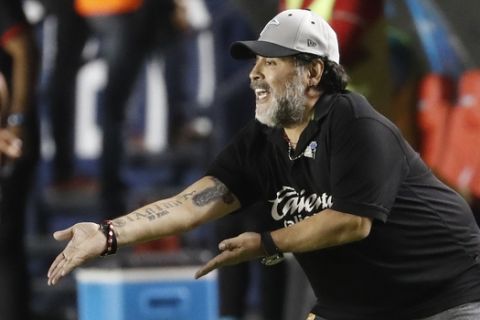 FILE - In this May 5, 2019 file photo, Dorados' head coach Diego Maradona shouts instructions to his players during extra time of a final leg match at a second division soccer league match against Atletico San Luis, in San Luis Potosi, Mexico. On the advice of his doctors, Maradona will not continue coaching the Dorados de Sinaloa, a second division Mexican team, according to the club and his representative on Thursday, June 13, 2019. (AP Photo/Eduardo Verdugo, File)