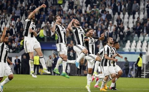 Juventus players celebrate their 3-0 win, at the end of a Champions League, quarterfinal, first-leg soccer match between Juventus and Barcelona, at the Juventus Stadium in Turin, Italy, Tuesday, April 11, 2017. (AP Photo/Antonio Calanni)