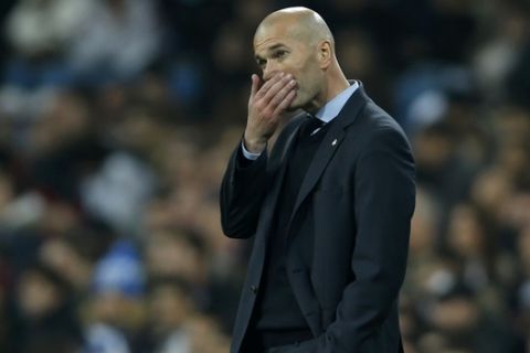 Real Madrid head coach Zinedine Zidane follows the action during the Spanish Copa del Rey quarterfinal second leg soccer match between Real Madrid and Leganes at the Santiago Bernabeu stadium in Madrid, Wednesday, Jan. 24, 2018. Leganes won 2-1. (AP Photo/Francisco Seco)