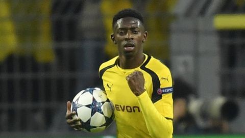 Dortmund's Ousmane Dembele celebrates after scoring his side's opening goal during the Champions League quarterfinal first leg soccer match between Borussia Dortmund and AS Monaco in Dortmund, Germany, Wednesday, April 12, 2017. (AP Photo/Martin Meissner)