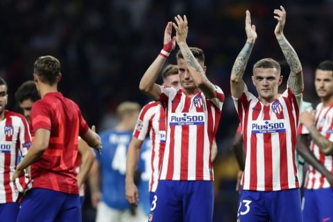 Atletico players applaud at their supporters at the end of the Champions League Group D soccer match between Atletico Madrid and Juventus at Wanda Metropolitano stadium in Madrid, Spain, Wednesday, Sept. 18, 2019. (AP Photo/Manu Fernandez)