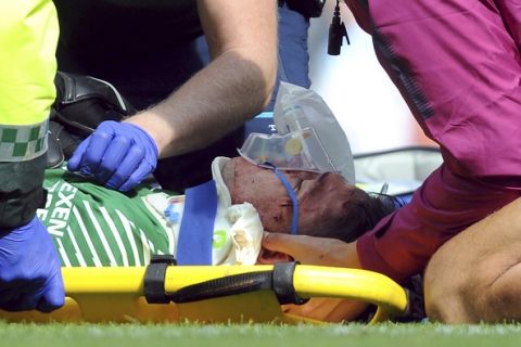 Manchester City's goalkeeper Ederson receives medical treatment during the English Premier League soccer match between Manchester City and Liverpool at the Etihad Stadium in Manchester, England, Saturday, Sept. 9, 2017. (AP Photo/Rui Vieira)