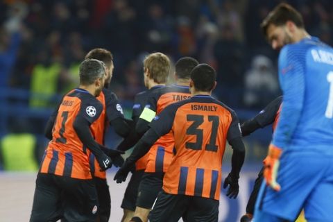 Shakhtar's Facundo Ferreyra celebrates with his teammates after scoring his side's opening goal during the Champions League, round of 16, first-leg soccer match between Shakhtar Donetsk and Roma at the Metalist Stadium in Kharkiv, Ukraine, Wednesday, Feb. 21, 2018. (AP Photo/Efrem Lukatsky)