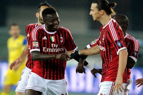 VERONA, ITALY - APRIL 10:  Sulley Muntari #14 celebrates with Zlatan Ibrahimovic #11 of AC Milan after scoring the first goal during the Serie A match between AC Chievo Verona and AC Milan at Stadio Marc'Antonio Bentegodi on April 10, 2012 in Verona, Italy.  (Photo by Claudio Villa/Getty Images)