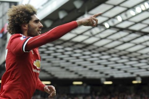 Manchester United's Marouane Fellaini celebrates after scoring his side's second goal during the English Premier League soccer match between Manchester United and Arsenal at the Old Trafford stadium in Manchester, England, Sunday, April 29, 2018. (AP Photo/Rui Vieira)