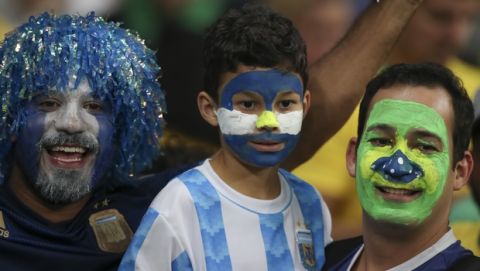 Fans of Brazil and Argentina cheer to their teams prior to a Copa America semifinal soccer match at the Mineirao stadium in Belo Horizonte, Brazil, Tuesday, July 2, 2019. (AP Photo/Ricardo Mazalan)