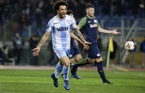 Lazio's Felipe Anderson, left, celebrates after scoring his side's third goal during a Europa League quarterfinal first leg soccer match between Lazio and FC Red Bull Salzburg in Rome, Thursday, April 5, 2018. (AP Photo/Gregorio Borgia)