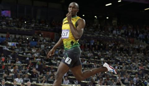 FILE - In this Thursday, Aug. 9, 2012 file photo, Jamaica's Usain Bolt gestures as he crosses the finish line to win gold in the men's 200-meter final during the athletics in the Olympic Stadium at the 2012 Summer Olympics, in London. (AP Photo/David J. Phillip, File)
