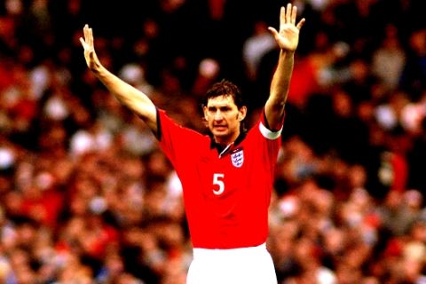 England's Tony Adams gestures during the group 9 World Cup Championship 2002 qualification match England versus Germany at the London Wembley stadium, Saturday Oct. 7, 2000. The match is the last one ever played at the famous Wembley stadium which will be teared down and replaced by a modern designed arena. (AP Photo/Christof Stache)