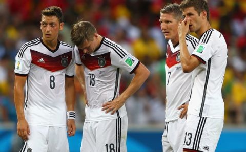 FORTALEZA, BRAZIL - JUNE 21:  (L-R) Mesut Oezil, Toni Kroos , Bastian Schweinsteiger and Thomas Mueller of Germany wait to take a free kick during the 2014 FIFA World Cup Brazil Group G match between Germany and Ghana at Castelao on June 21, 2014 in Fortaleza, Brazil.  (Photo by Michael Steele/Getty Images)