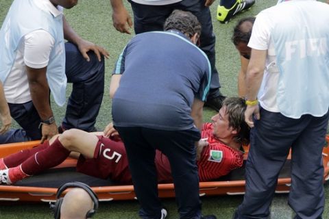 Portugal's Fabio Coentrao is taken away on a stretcher after being injured during the group G World Cup soccer match between Germany and Portugal at the Arena Fonte Nova in Salvador, Brazil, Monday, June 16, 2014.  (AP Photo/Christophe Ena)