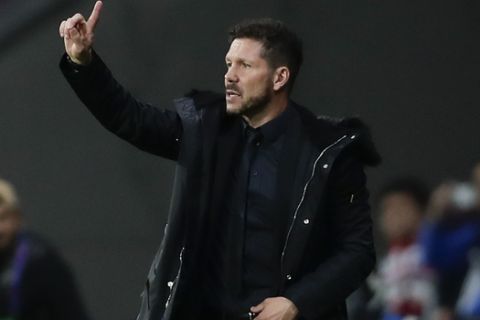 Atletico coach Diego Simeone gives instructions during the Group A Champions League soccer match between Atletico Madrid and Borussia Dortmund at the Wanda Metropolitano stadium in Madrid, Spain, Tuesday, Nov. 6, 2018. (AP Photo/Manu Fernandez)