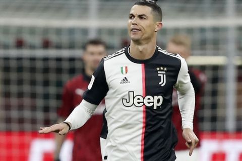 Juventus' Cristiano Ronaldo celebrate after scores with penalty against AC Milan during an Italian Cup soccer match between AC Milan and Juventus at the San Siro stadium, in Milan, Italy, Thursday, Feb. 13, 2020. (AP Photo/Antonio Calanni)