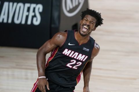 Miami Heat forward Jimmy Butler (22) reacts after scoring against the Indiana Pacers during the second half of an NBA basketball first round playoff game, Tuesday, Aug. 18, 2020, in Lake Buena Vista, Fla. (AP Photo/Ashley Landis, Pool)