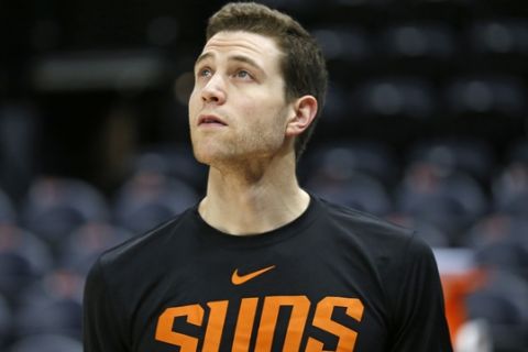 Phoenix Suns guard Jimmer Fredette looks on while warming-up before the start of their NBA basketball game against the Utah Jazz Monday, March 25, 2019, in Salt Lake City. (AP Photo/Rick Bowmer)