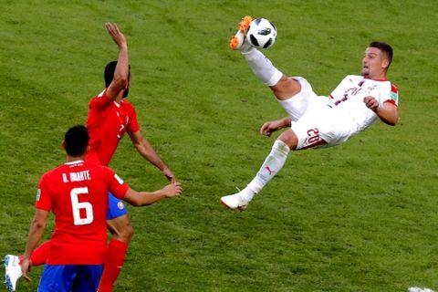 Serbia's Sergej Milinkovic-Savic, right, kicks the ball as Costa Rica's Giancarlo Gonzalez tries to stop him during the group E match between Costa Rica and Serbia at the 2018 soccer World Cup in the Samara Arena in Samara, Russia, Sunday, June 17, 2018. (AP Photo/Vadim Ghirda)