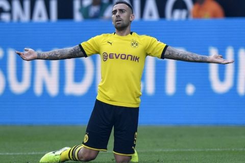 Dortmund's Paco Alcacer reacts during the German Bundesliga soccer match between Borussia Dortmund and Bayer Leverkusen in Dortmund, Germany, Saturday Sept. 14, 2019. (AP Photo/Martin Meissner)