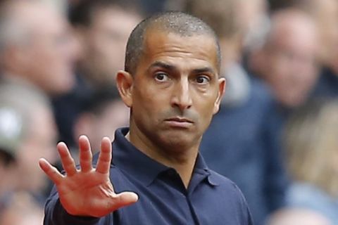 Rennes' coach Sabri Lamouchi gestures during the French League One soccer match between Rennes and Paris-Saint-Germain at Roazhon Park stadium in Rennes, western France, Sunday, Sept. 23, 2018. (AP Photo/Michel Euler)