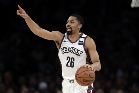 Brooklyn Nets' Spencer Dinwiddie (26) dribbles against the Los Angeles Lakers during the second half of an NBA basketball game Tuesday, March 10, 2020, in Los Angeles. (AP Photo/Marcio Jose Sanchez)